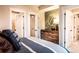 Spacious bedroom with dresser, walk-in closet, and adjacent bathroom at 715 Crossroad Ct, Powder Springs, GA 30127