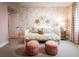 Charming bedroom with floral wallpaper and a daybed featuring coral ottomans at 715 Crossroad Ct, Powder Springs, GA 30127