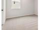Clean empty bedroom features carpet, a window, and a door at 715 Crossroad Ct, Powder Springs, GA 30127