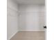 Walk-in closet with ample storage space, wire shelving, and carpet flooring, offering a practical storage solution at 715 Crossroad Ct, Powder Springs, GA 30127