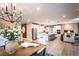 Open concept dining room with chandelier and access to deck at 715 Crossroad Ct, Powder Springs, GA 30127