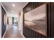 Elegant hallway with wood wall accents and large artwork at 715 Crossroad Ct, Powder Springs, GA 30127