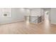 Hallway with hardwood floors, staircase with black iron spindles, and natural light at 715 Crossroad Ct, Powder Springs, GA 30127