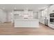Modern kitchen featuring a large island, stainless steel appliances, and plenty of cabinet space at 715 Crossroad Ct, Powder Springs, GA 30127