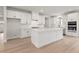 Modern kitchen with white cabinets, large island, stainless steel appliances and hardwood floor at 715 Crossroad Ct, Powder Springs, GA 30127