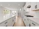 Well-lit kitchen features a large island, stainless steel appliances, and an open view to the living area at 715 Crossroad Ct, Powder Springs, GA 30127