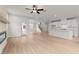 Bright, open-concept living room with a fireplace and direct access to the modern kitchen and backyard at 715 Crossroad Ct, Powder Springs, GA 30127