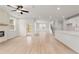 Spacious living room with fireplace, recessed lighting, and view of the staircase and kitchen at 715 Crossroad Ct, Powder Springs, GA 30127