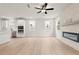 Open living space with a fireplace, modern fixtures, and a seamless transition to the adjacent kitchen at 715 Crossroad Ct, Powder Springs, GA 30127