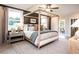 Main bedroom with canopy bed, wood flooring, and access to a deck at 715 Crossroad Ct, Powder Springs, GA 30127
