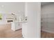 View of the kitchen island, living room with fireplace, and walk in pantry with metal shelving at 715 Crossroad Ct, Powder Springs, GA 30127