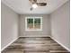 Simple bedroom with ceiling fan and window view at 2068 Verbena Nw St, Atlanta, GA 30314