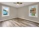 Bright bedroom with two windows and wood-look floors at 2068 Verbena Nw St, Atlanta, GA 30314