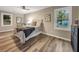 Bedroom with queen bed, neutral decor, and view of backyard at 2068 Verbena Nw St, Atlanta, GA 30314