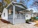 Newly renovated house with gray porch and landscaping at 2068 Verbena Nw St, Atlanta, GA 30314