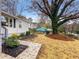 Landscaped front yard with a large tree at 2068 Verbena Nw St, Atlanta, GA 30314