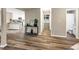 Hallway with light neutral walls and hardwood floors, leading to bedrooms and bath at 2068 Verbena Nw St, Atlanta, GA 30314