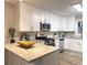 Modern kitchen with white cabinets, granite counters, and stainless steel appliances at 2068 Verbena Nw St, Atlanta, GA 30314