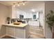 Modern kitchen with white cabinets, granite counters, and stainless steel appliances at 2068 Verbena Nw St, Atlanta, GA 30314