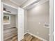 Laundry room with built-in shelving and vinyl flooring at 2068 Verbena Nw St, Atlanta, GA 30314