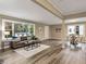 Open living and dining area with hardwood floors and neutral color palette at 2068 Verbena Nw St, Atlanta, GA 30314