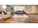 Spacious living room with large windows, comfortable seating, and hardwood floors at 2068 Verbena Nw St, Atlanta, GA 30314