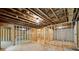 Unfinished basement with exposed framing, offering potential for customization and additional living space at 220 Autumn Brook Dr, Canton, GA 30115
