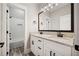 Bathroom featuring white cabinets, granite countertop, double sink, and a shower with white subway tile at 220 Autumn Brook Dr, Canton, GA 30115