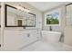 Bright bathroom featuring a soaking tub, glass shower, and granite counters at 220 Autumn Brook Dr, Canton, GA 30115