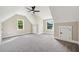 Bedroom featuring neutral walls, plush gray carpet, a modern ceiling fan and two windows at 220 Autumn Brook Dr, Canton, GA 30115