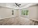 Bright bedroom featuring large windows and wood-look flooring at 220 Autumn Brook Dr, Canton, GA 30115