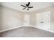 Bedroom featuring neutral walls, plush gray carpet, a modern ceiling fan, and a closet at 220 Autumn Brook Dr, Canton, GA 30115