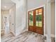 Bright foyer featuring wood-framed glass front doors that enhance the entrance and style at 220 Autumn Brook Dr, Canton, GA 30115