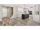 Open concept kitchen with center island, modern appliances, and hardwood floors throughout at 220 Autumn Brook Dr, Canton, GA 30115