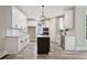 Gourmet kitchen boasts a center island, stainless steel appliances, and custom cabinetry at 220 Autumn Brook Dr, Canton, GA 30115
