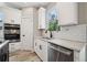 Modern kitchen with stainless steel appliances, granite countertops, and a double basin sink at 220 Autumn Brook Dr, Canton, GA 30115