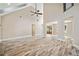 Open concept living room with hardwood floors and high ceilings at 220 Autumn Brook Dr, Canton, GA 30115