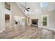 The open living area has high ceilings, a stone fireplace, and a view of the modern kitchen at 220 Autumn Brook Dr, Canton, GA 30115