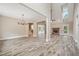 Open-concept space features kitchen with island, living room fireplace and entry, ideal for entertaining at 220 Autumn Brook Dr, Canton, GA 30115