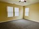 Large bedroom with neutral carpeting and multiple windows at 522 Rendezvous Rd, Acworth, GA 30102