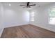 Bright bedroom with wood floors and ceiling fan at 1043 Smith Sw St, Atlanta, GA 30310