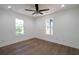Spacious bedroom with wood floors and ceiling fan at 1043 Smith Sw St, Atlanta, GA 30310