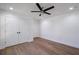 Bedroom with wood floors, ceiling fan, and double doors at 1043 Smith Sw St, Atlanta, GA 30310