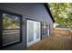 Gray siding house with white french doors and deck at 1043 Smith Sw St, Atlanta, GA 30310