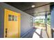 Bright yellow front door and light-colored porch at 1043 Smith Sw St, Atlanta, GA 30310