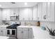 Modern kitchen with white cabinets and quartz countertops at 1043 Smith Sw St, Atlanta, GA 30310