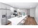 Modern kitchen with white cabinets, quartz countertops, and stainless steel appliances at 1043 Smith Sw St, Atlanta, GA 30310