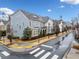 Community of upscale townhouses with a tree-lined street at 228 Dawson Dr, Woodstock, GA 30188