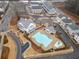 Aerial view of community pool, clubhouse, and townhomes at 228 Dawson Dr, Woodstock, GA 30188