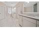 Large bathroom with double vanity and marble flooring at 228 Dawson Dr, Woodstock, GA 30188